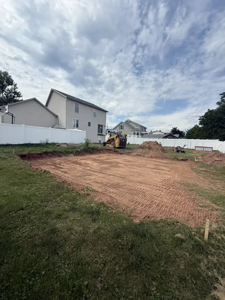 Backyard pad excavated and leveled for a new structure