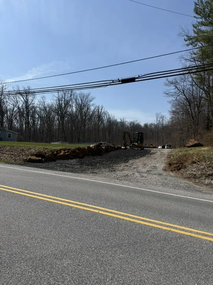 Roadside lot clearing and grading along a rural road