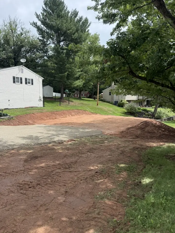 Site preparation for a shed pad next to a home