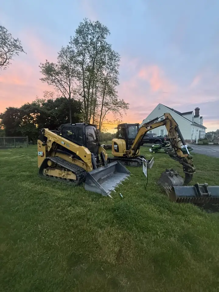 Shenk Excavation skid steer and mini excavator on a residential job site