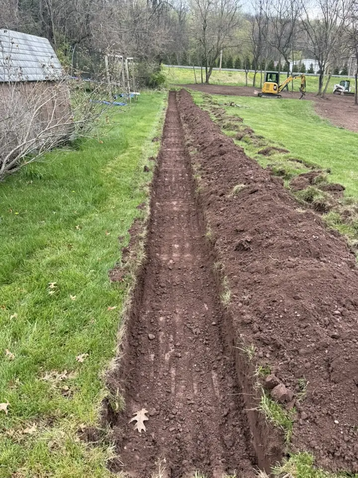 Utility trench dug across a residential lawn in Central PA